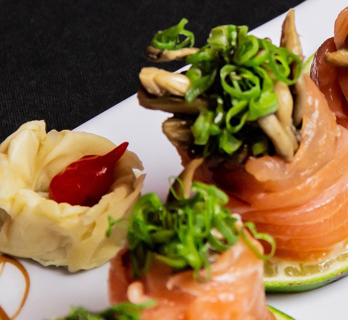 Salmon sushi pieces with garnish at IRO Sushi